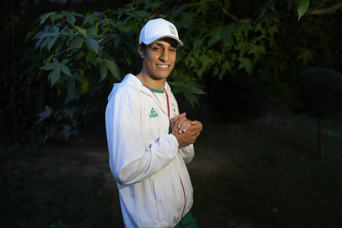 Algerian boxer Imane Khelif poses for a photo after an interview with SNTV at the 2024 Summer O ...