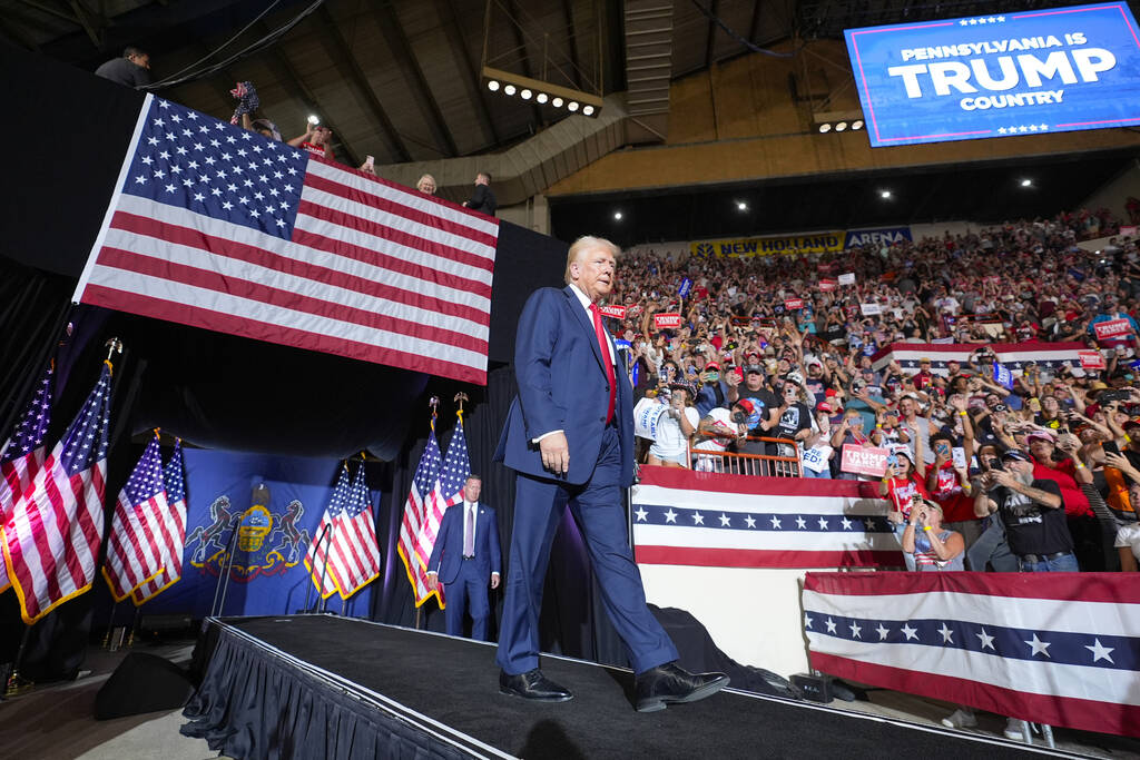 FILE - Republican presidential candidate former President Donald Trump arrives to speak at a ca ...