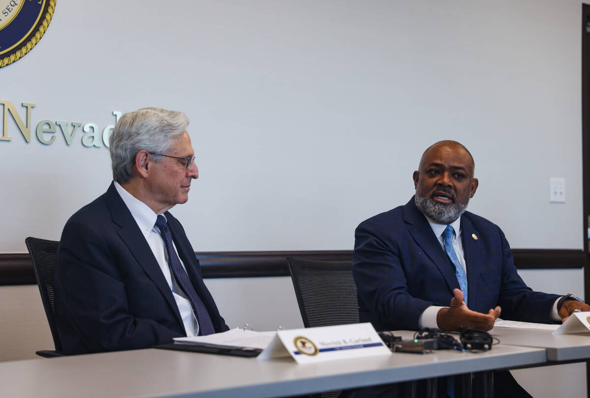 U.S. Attorney Jason Frierson, right, speaks next to U.S. Attorney General Merrick Garland, left ...