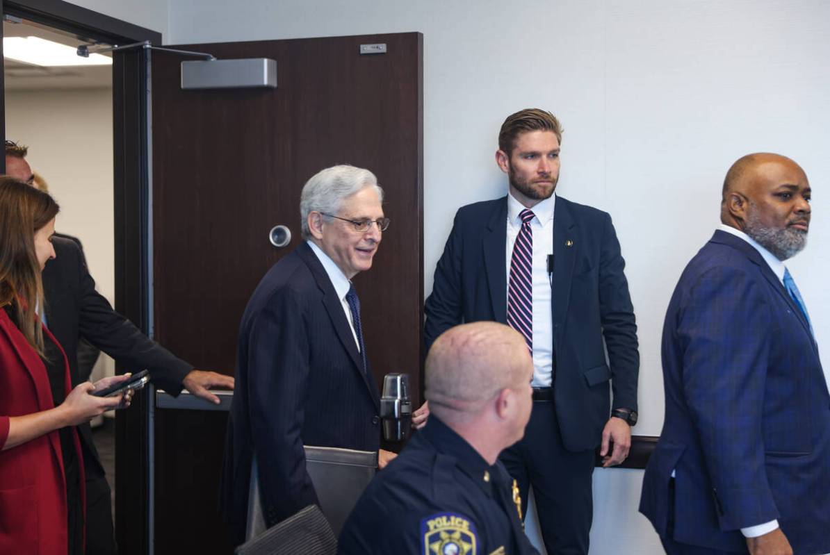 U.S. Attorney General Merrick Garland enters the room behind U.S. Attorney Jason Frierson for a ...