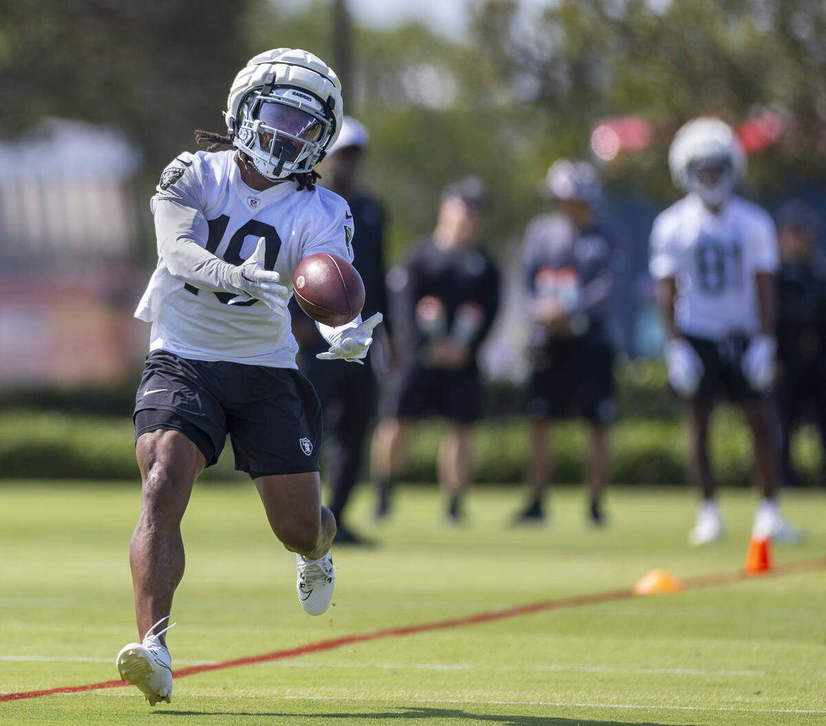 Raiders wide receiver DJ Turner (19) catches a pass during the first day of Raiders training ca ...