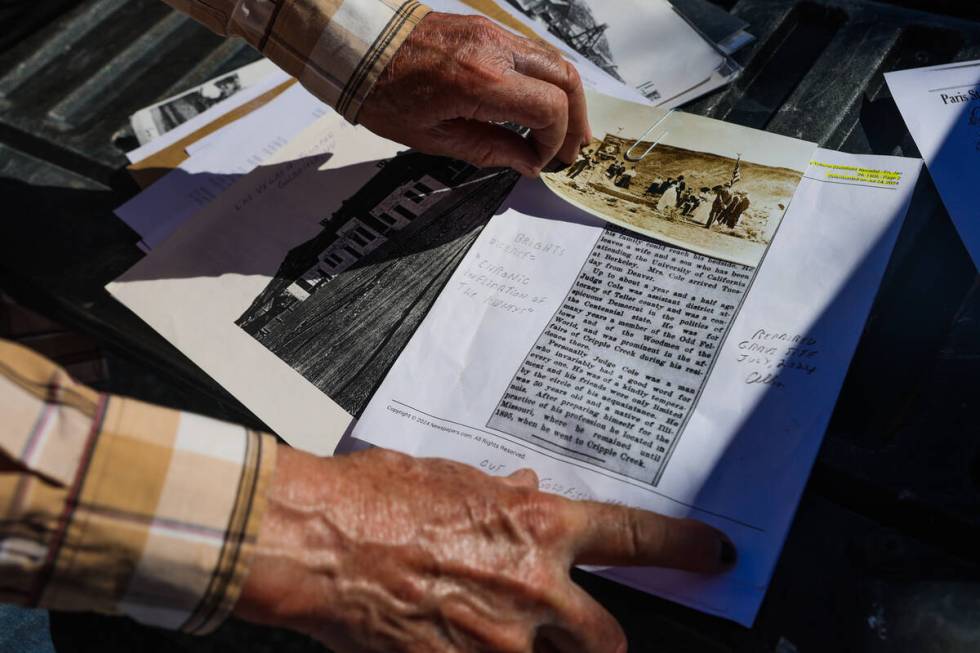 Allen Metscher sorts through historical Goldfield documents on Saturday, Aug. 3, 2024, in Goldf ...