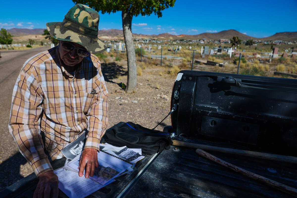 Allen Metscher sorts through historical Goldfield documents on Saturday, Aug. 3, 2024, in Goldf ...