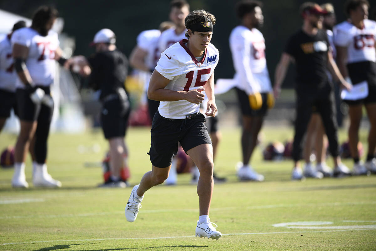 Washington Commanders wide receiver Dax Milne (15) works out during NFL football training camp, ...