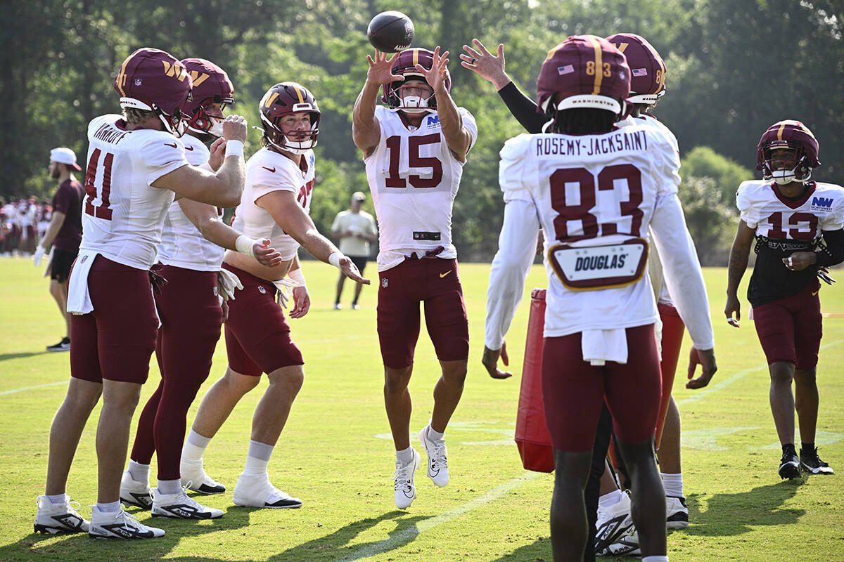 Washington Commanders wide receiver Dax Milne (15) works out during NFL football training camp, ...