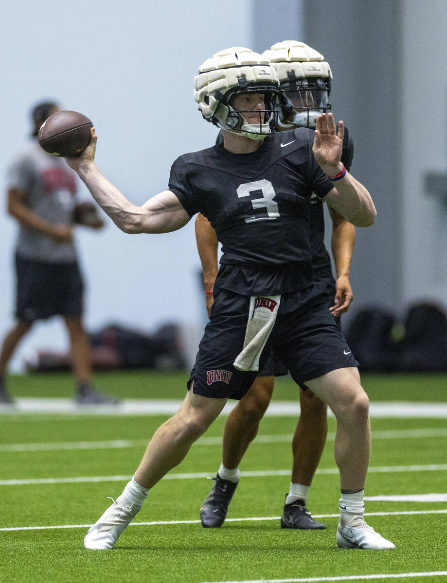 UNLV quarterback Matthew Sluka (3) eyes a receiver for a throw during football practice at the ...