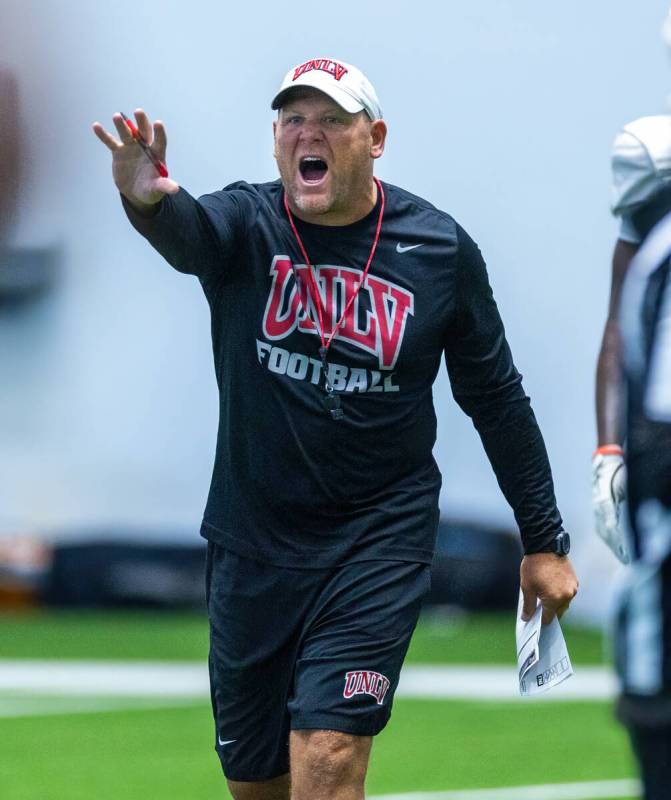 UNLV head coach Barry Odom yells at his players during football practice at the Intermountain H ...