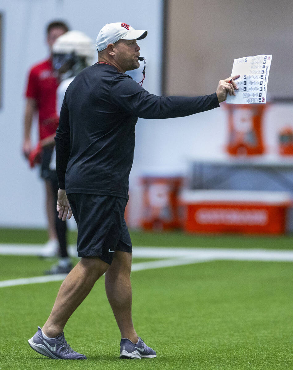 UNLV head coach Barry Odom instructs his players during football practice at the Intermountain ...