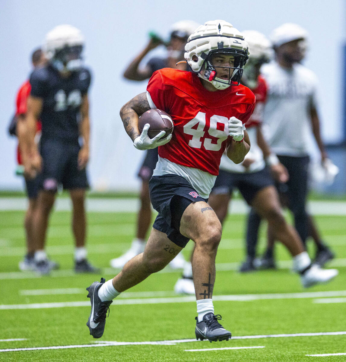 UNLV running back Jacob Rosendahl (49) runs up the field during football practice at the Interm ...