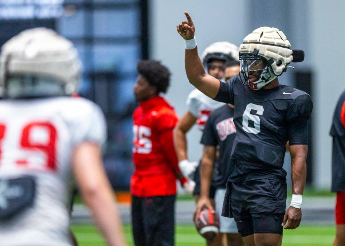 UNLV quarterback Hajj-Malik Williams (6) signals to a receiver during football practice at the ...