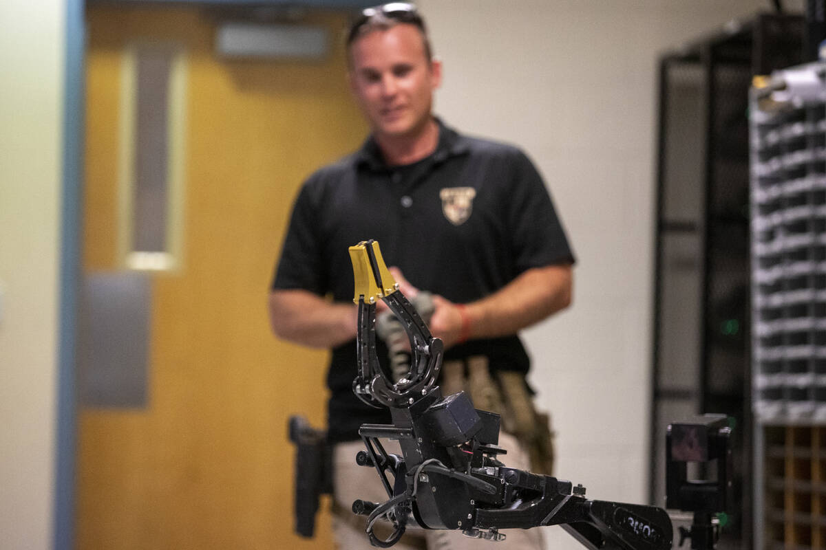 Skyler Lee, of the Las Vegas Metro Police Department ARMOR division, controls the T5 robot to d ...