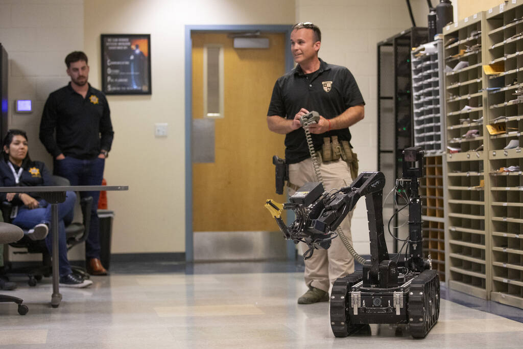 Skyler Lee, of the Las Vegas Metro Police Department ARMOR division, controls the T5 robot to d ...