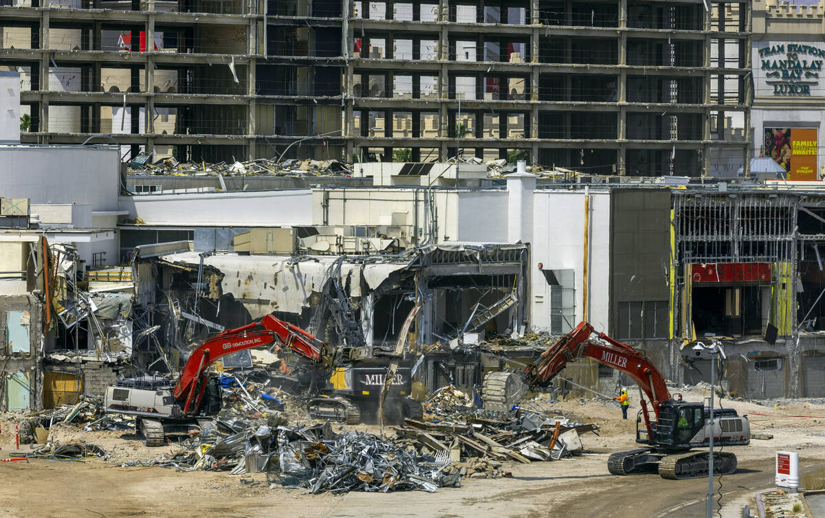 Machinery rips down some of the lower structures as the deconstruction of the Tropicana continu ...