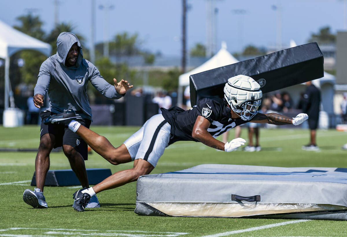 Raiders safety Isaiah Pola-Mao (20) takes out a tackling pad on a drill during the second day o ...