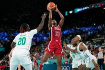 United States' Jackie Young (13) shoots between Murjanatu Musa (20) and Ezinne Kalu (23), of Ni ...