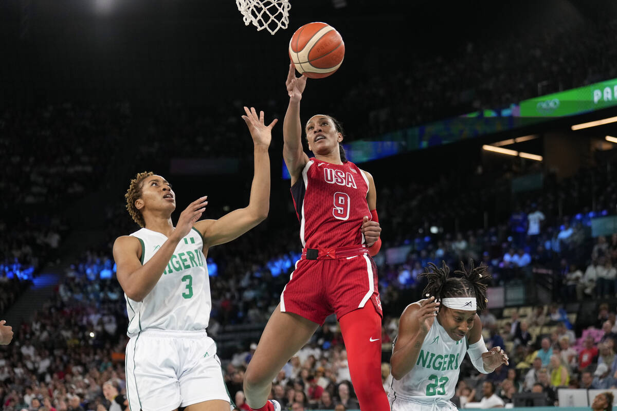 United States' A'ja Wilson (9) shoots between Pallas Kunayi Akpanah (3) and Ezinne Kalu (23), o ...