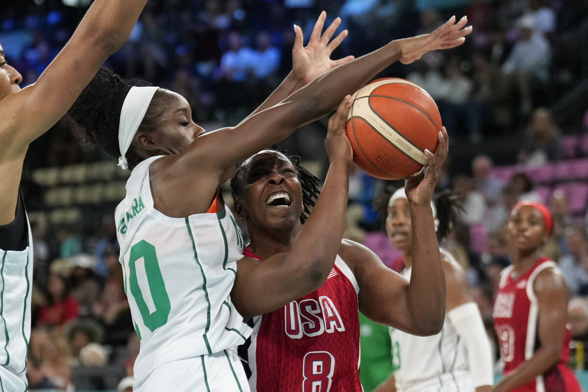 Promise Amukamara (10), of Nigeria, fouls United States' Chelsea Gray (8) during a women's quar ...