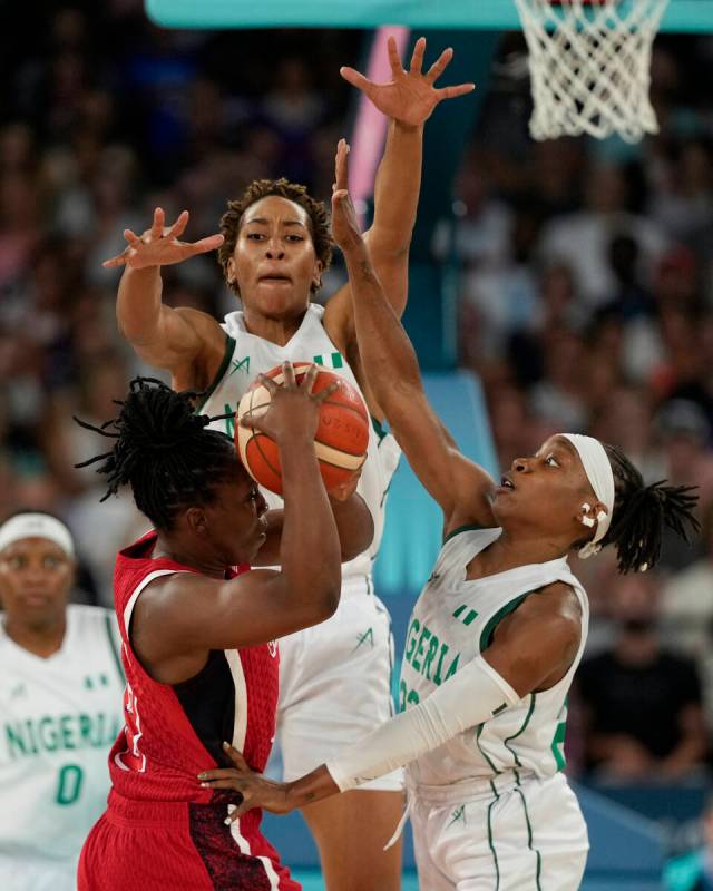 Pallas Kunayi Akpanah, left, and Ezinne Kalu (23), of Nigeria, defend United States' Chelsea Gr ...