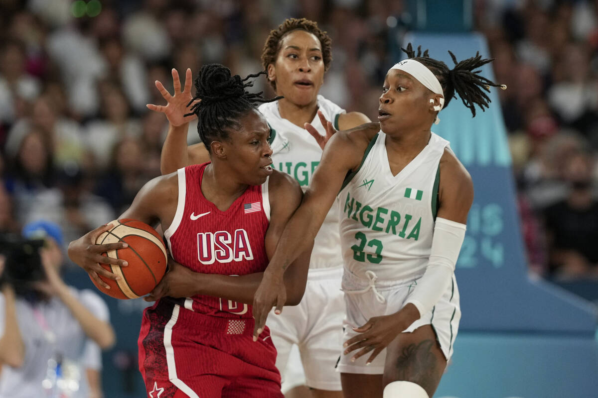 Pallas Kunayi Akpanah, left, and Ezinne Kalu (23), of Nigeria, defend United States' Chelsea Gr ...