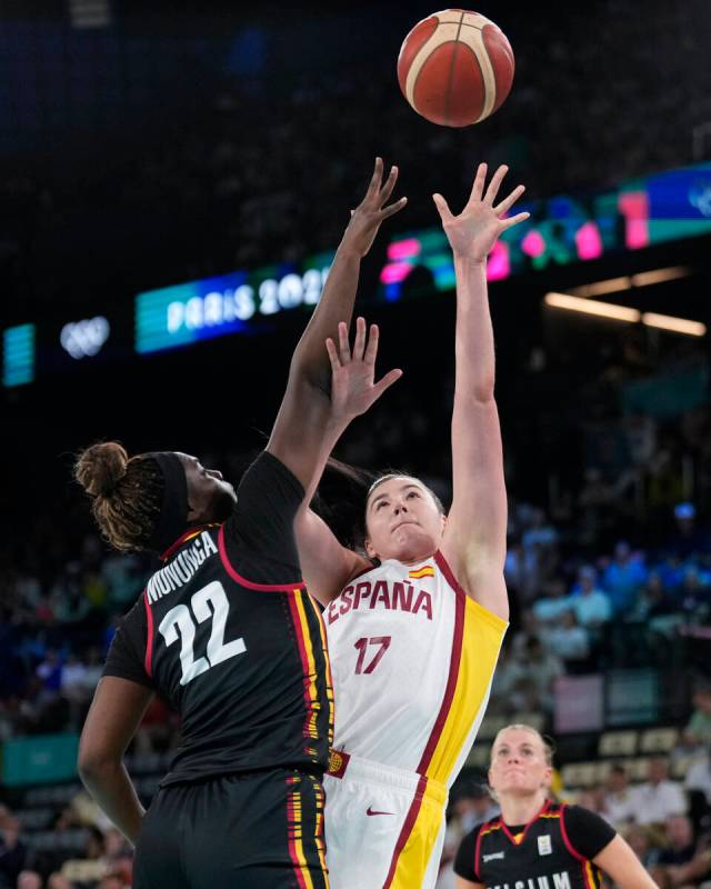 Megan Gustafson (17), of Spain, shoots over Bethy Mununga (22), of Belgium, during a women's qu ...