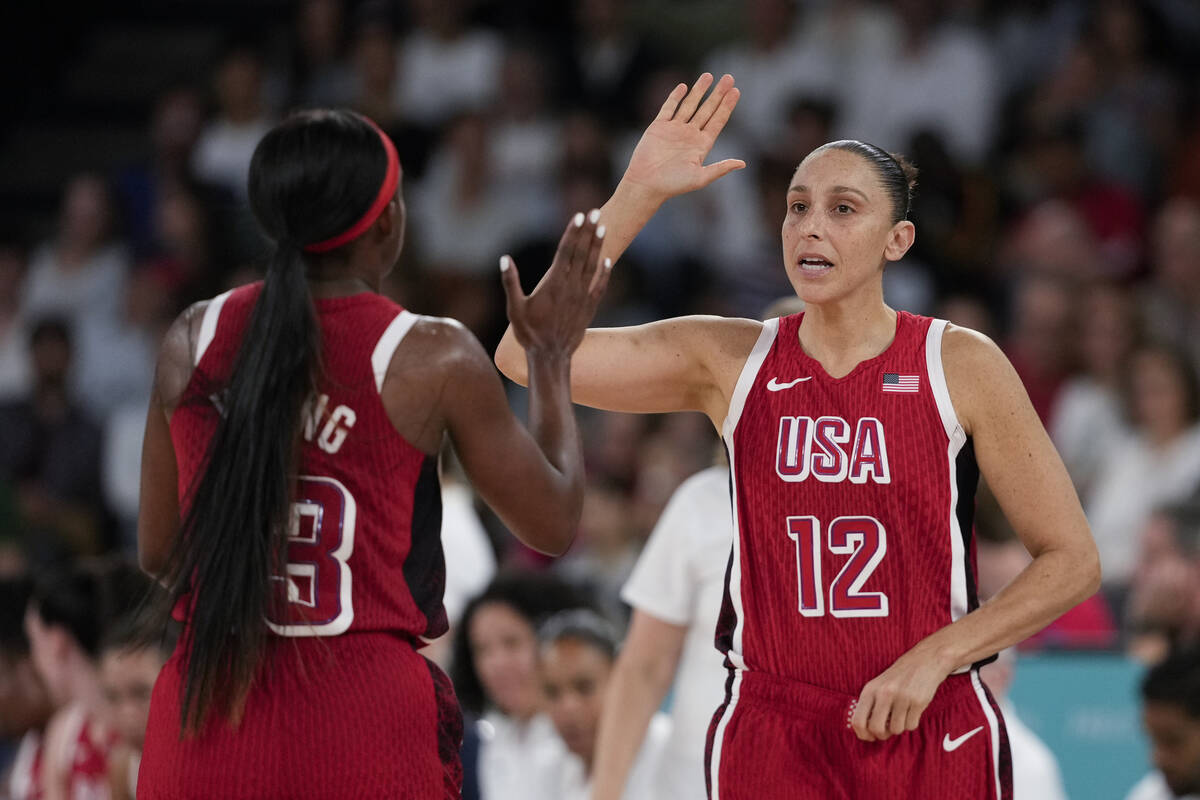 United States' Diana Taurasi (12) celebrates with United States' Jackie Young (13) during a wom ...