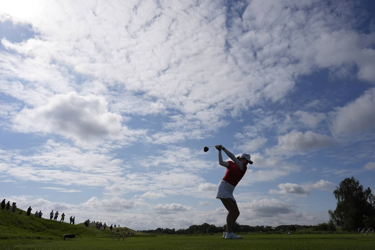 Rose Zhang, of the United States, plays her shot from the 3rd tee during the first round of the ...