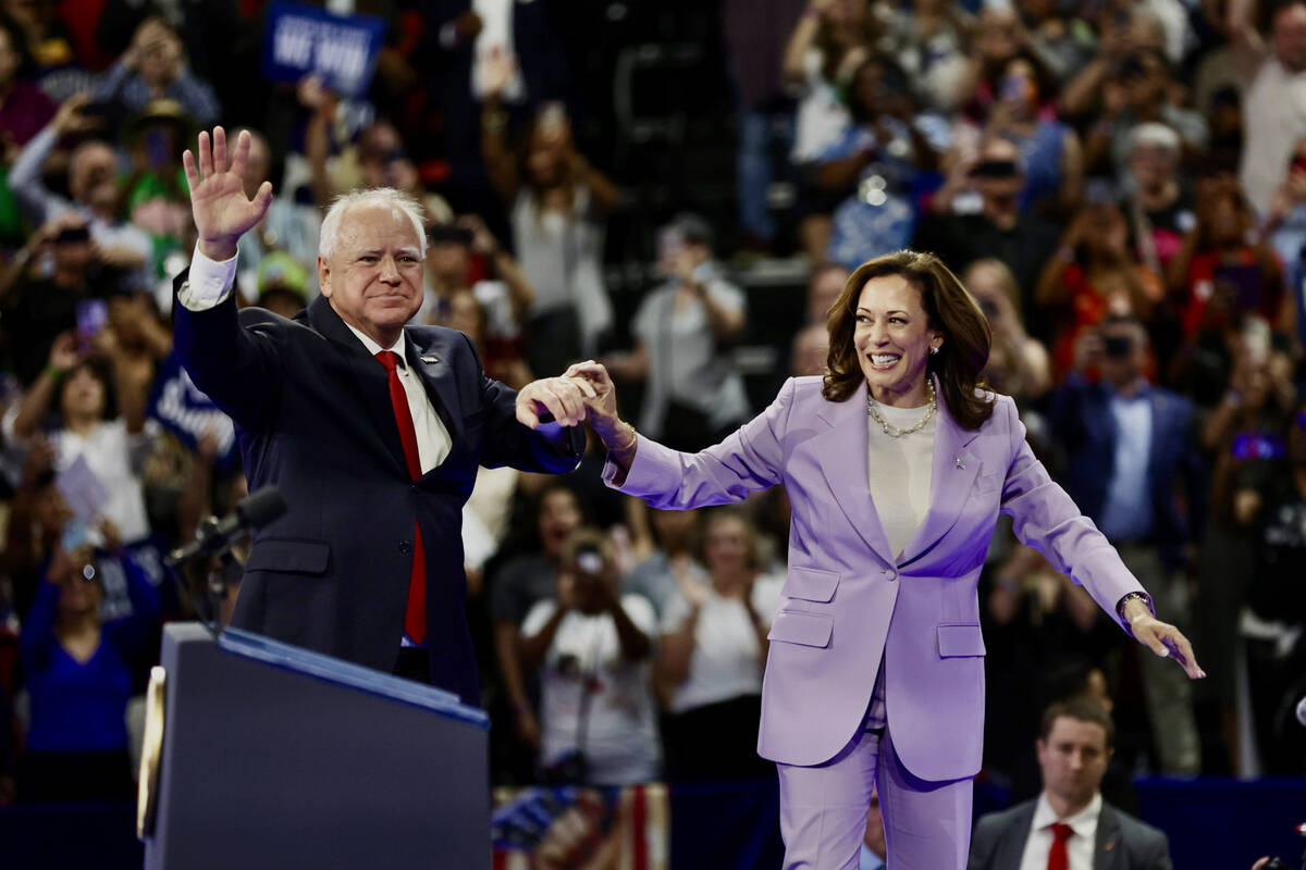 Minnesota Governor Tim Walz introduces Vice President Kamala Harris during a campaign rally Sat ...