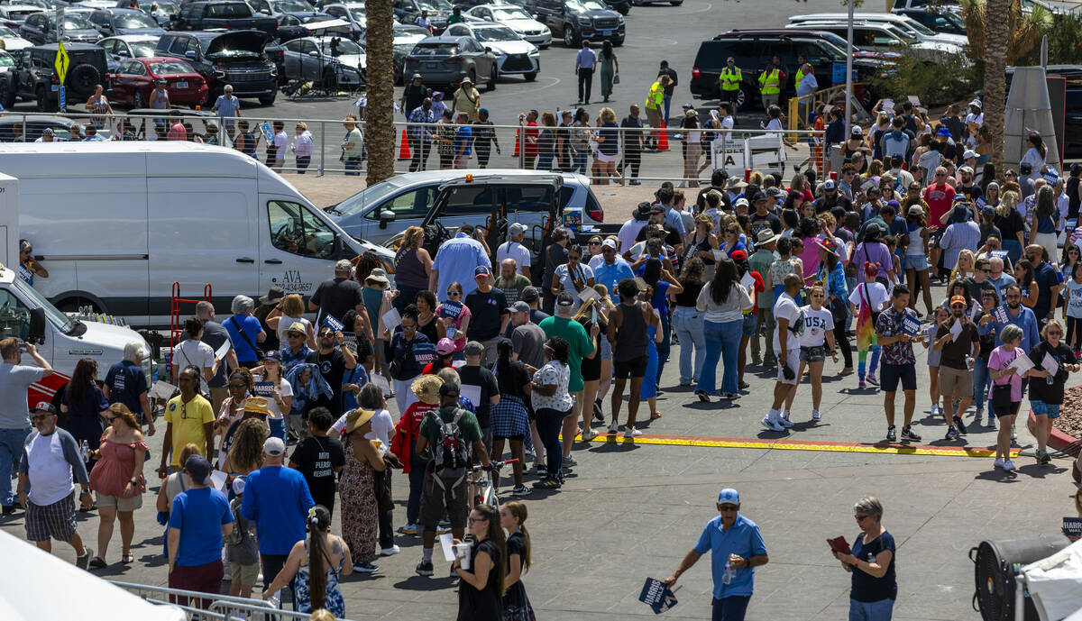 Attendees line up around the building to enter as Vice President Kamala Harris and her running ...