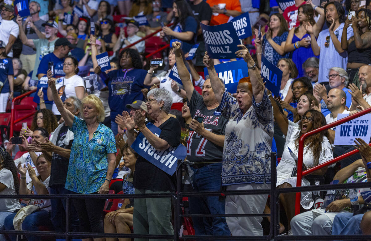 Supporters cheers as Vice President Kamala Harris speaks during a campaign rally at UNLV&#x2019 ...