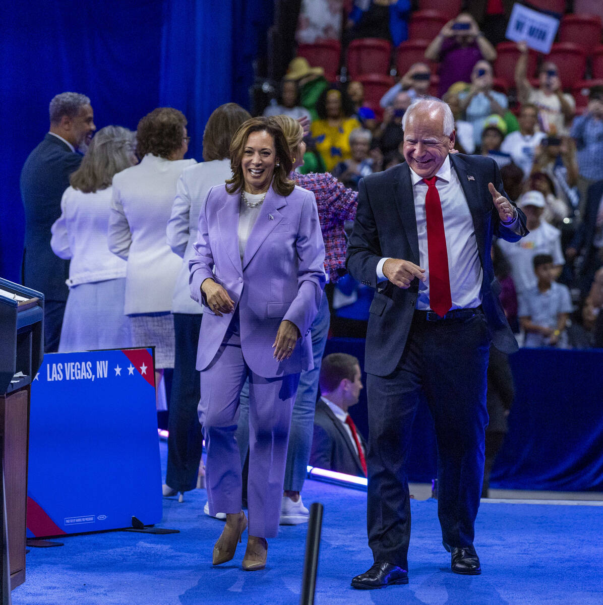 Vice President Kamala Harris and her running mate, Minnesota Gov. Tim Walz, leave the delegatio ...