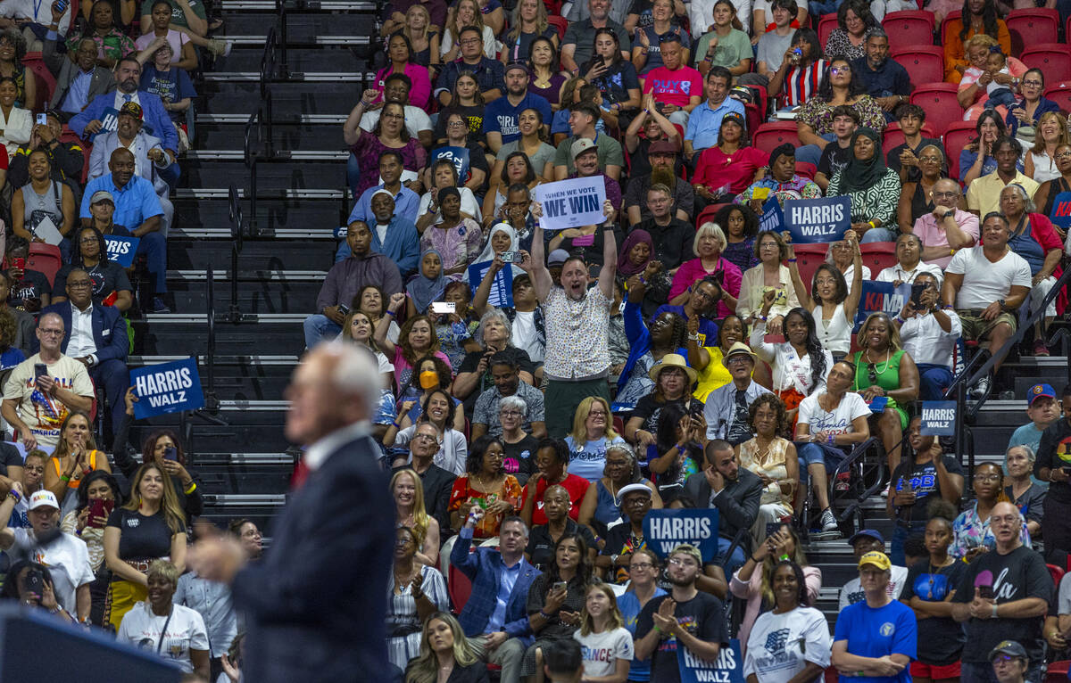 Supporters listen intently as Minnesota Gov. Tim Walz speaks during a campaign rally at UNLV&#x ...