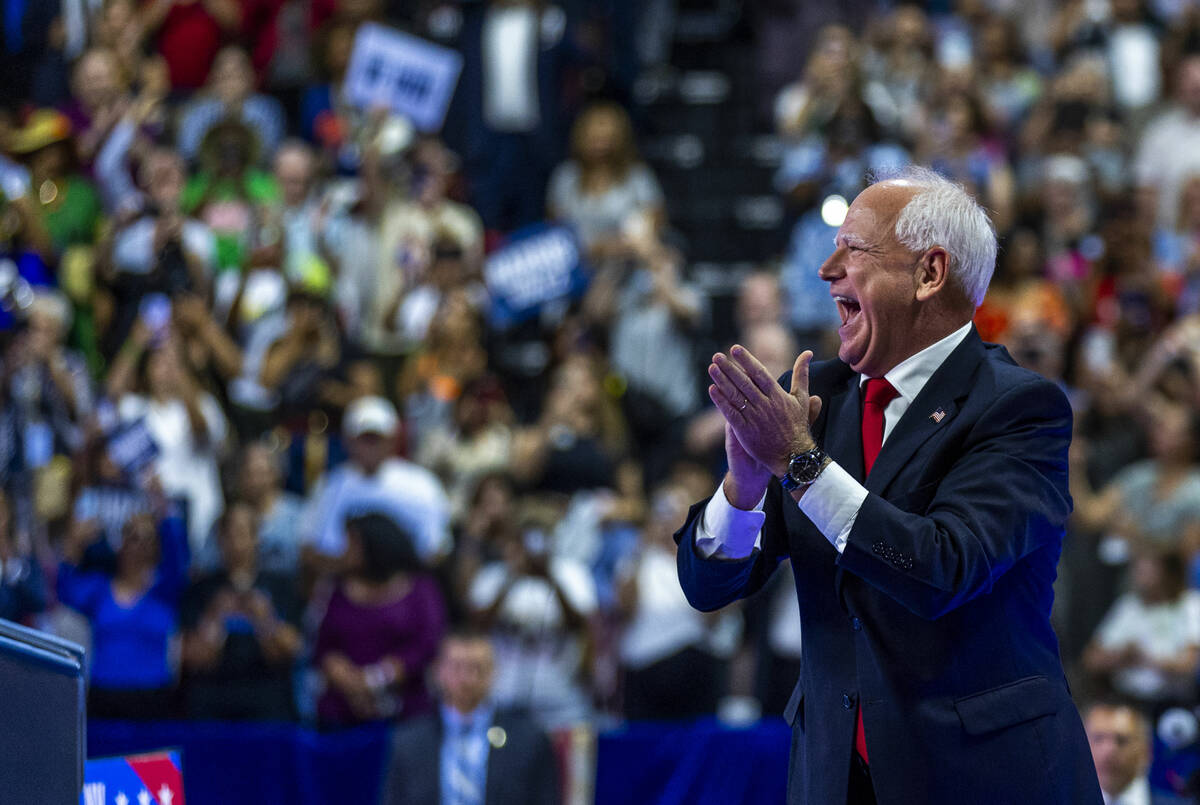 Minnesota Gov. Tim Walz, greets supporters on stage during a campaign rally at UNLV’s Th ...