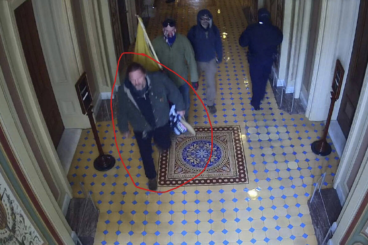 This image from U.S. Capitol Police video, released and annotated by the Justice Department in ...