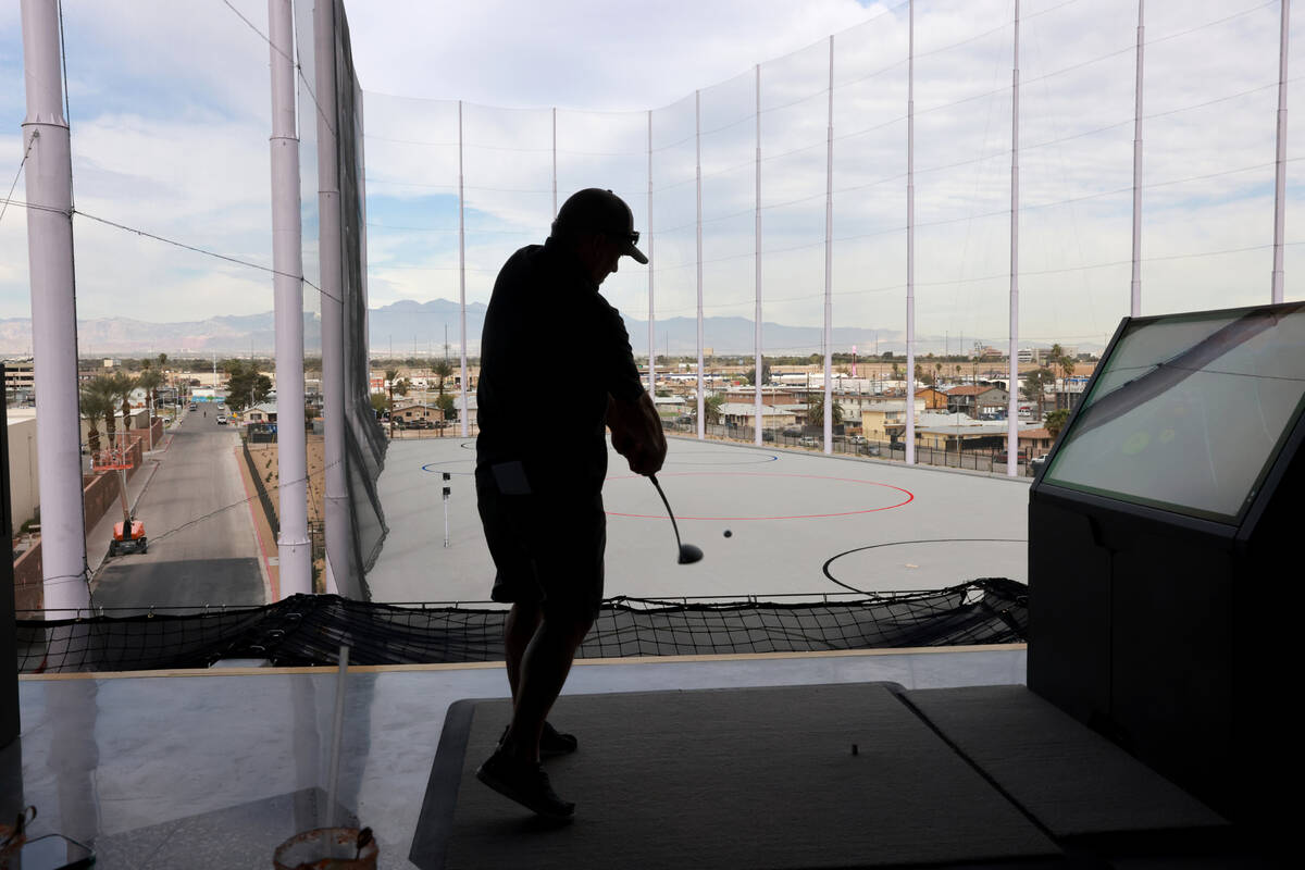 Dave Engstrom of Duluth, Minn. hits from a fourth floor bay at Atomic Golf adjacent to The Stra ...