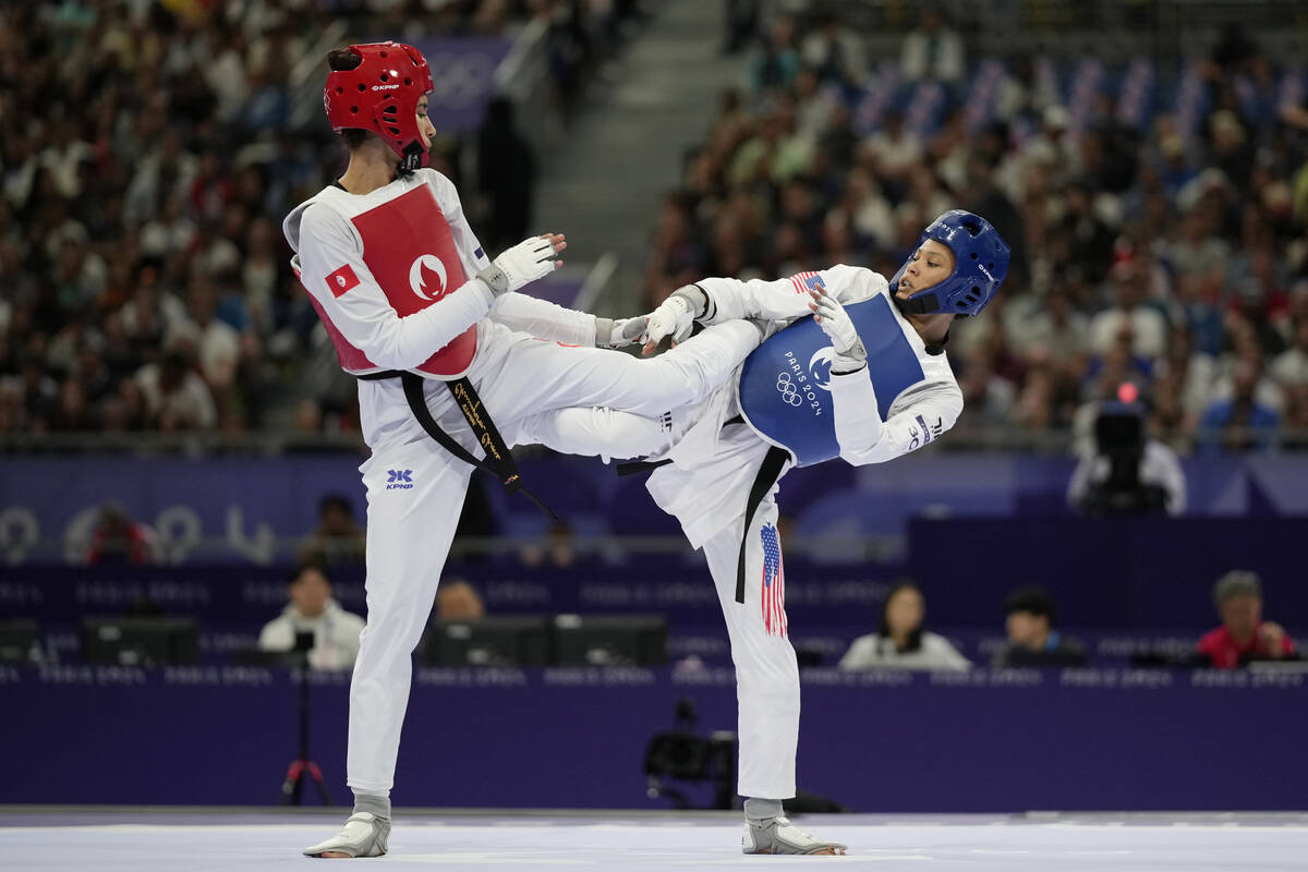 United States' Faith Dillon (in blue) competes with Tunisia's Chaima Toumi in a women's 57kg Ta ...