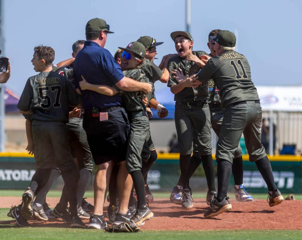 Nevada players celebrate with manager Adam Johnson after their 2-0 win over Utah in the Mountai ...