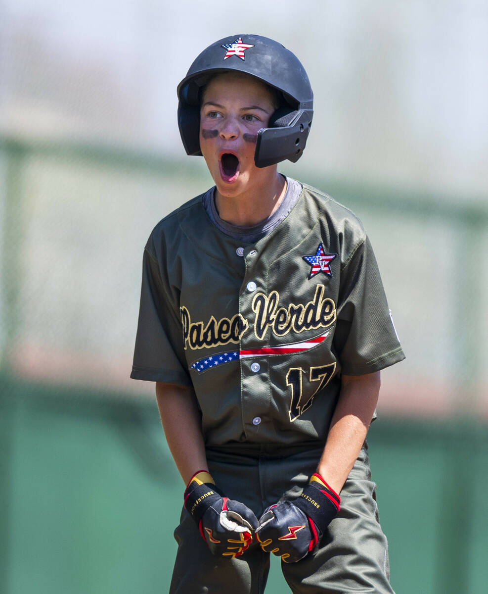 Nevada base runner Dominic Laino (17) is pumped up after safely sliding into third base against ...