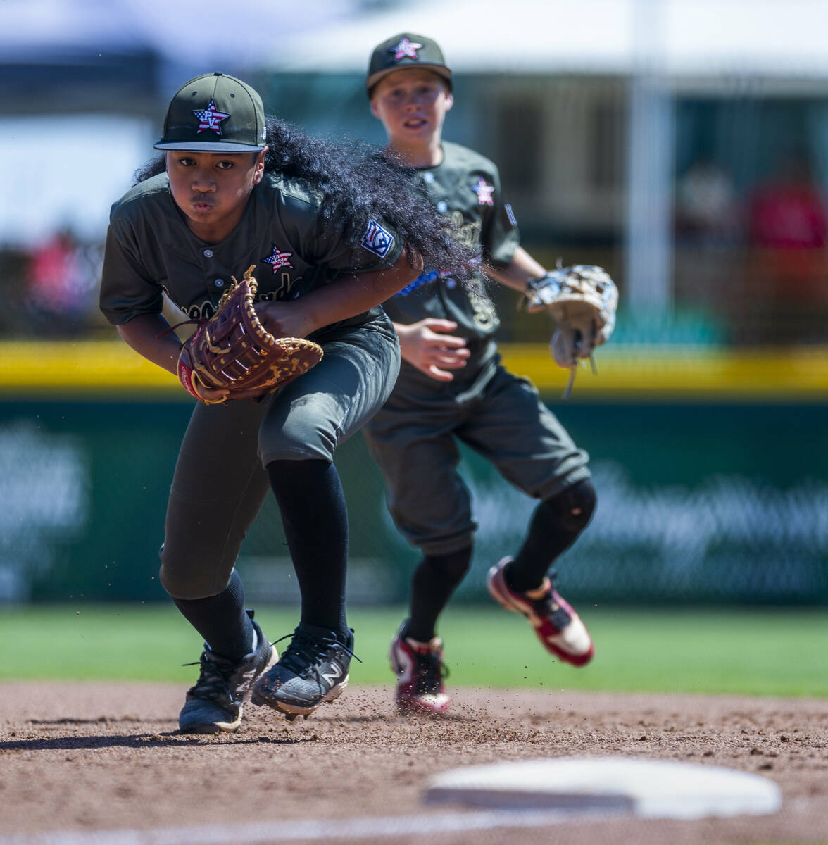 Nevada infielder Noah Letalu (13) runs back to the base after a catch for an out against Utah d ...