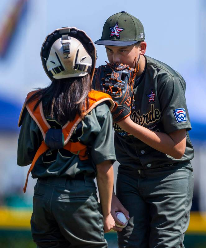 Nevada pitcher Wyatt Erickson (7) confers with catcher Parker Soranaka (23) on the mound agains ...