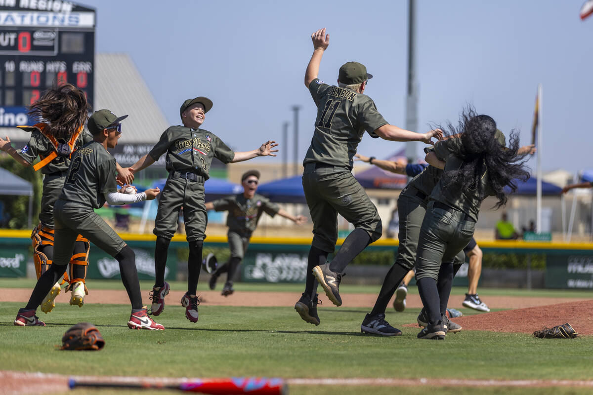 Nevada players celebrate their 2-0 win over Utah in the Mountain Regional final baseball game o ...