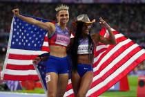 Women's long jump gold medalist, Tara Davis-Woodhall, right, and women's 400-meter hurdle gold ...