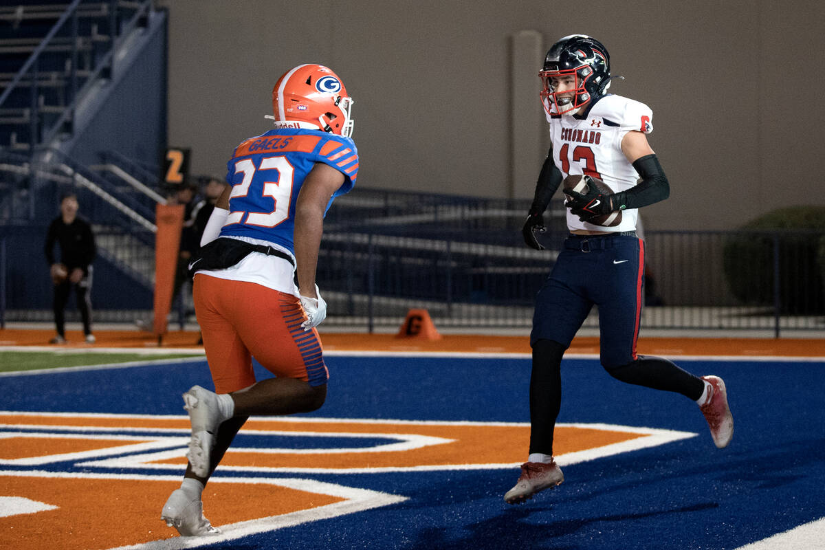 Coronado wide receiver Scott Holper (13) celebrates as he catches a touchdown pass against Bish ...