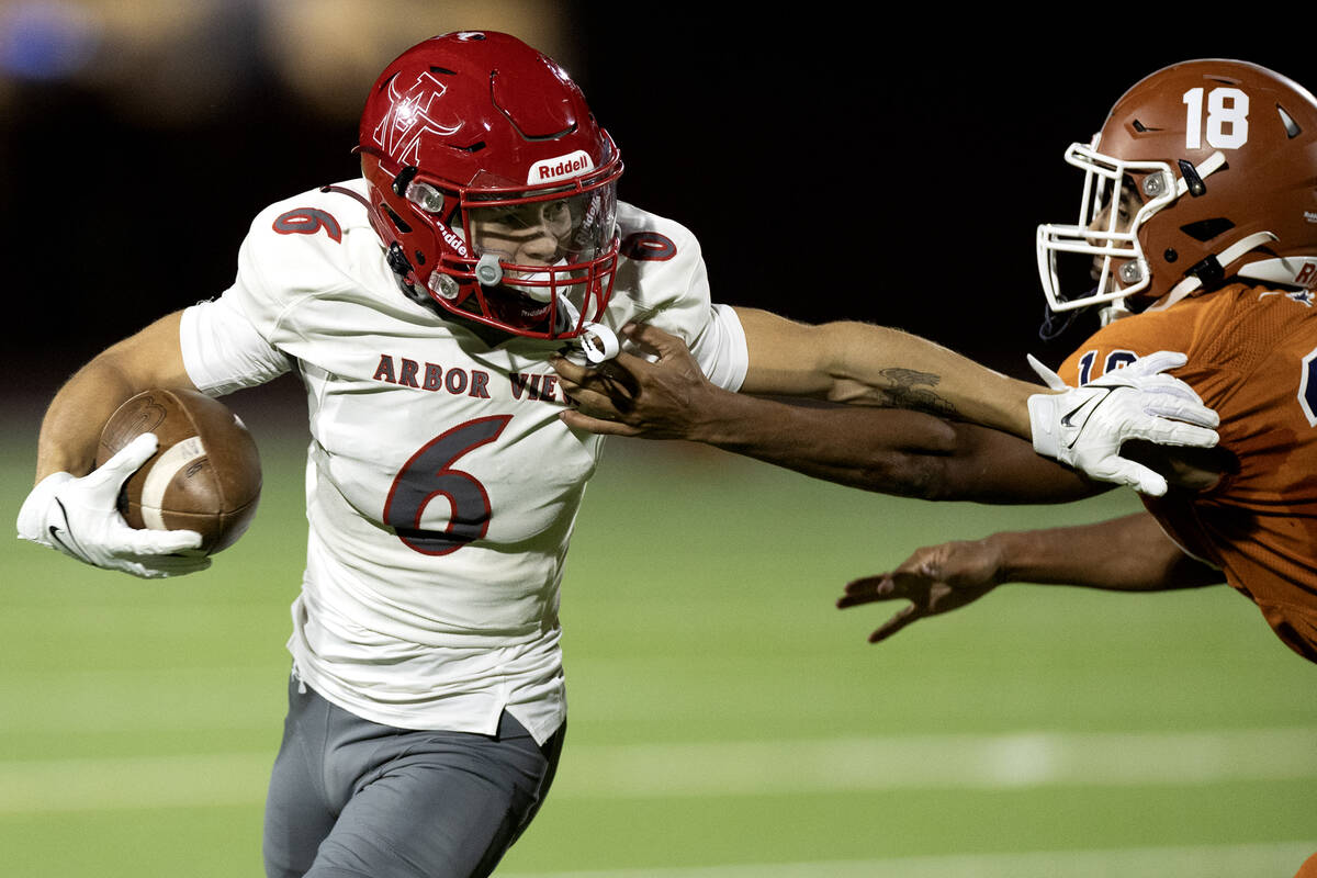 Arbor View wide receiver Jayden Williams (6) runs the ball with pressure from Legacy cornerback ...