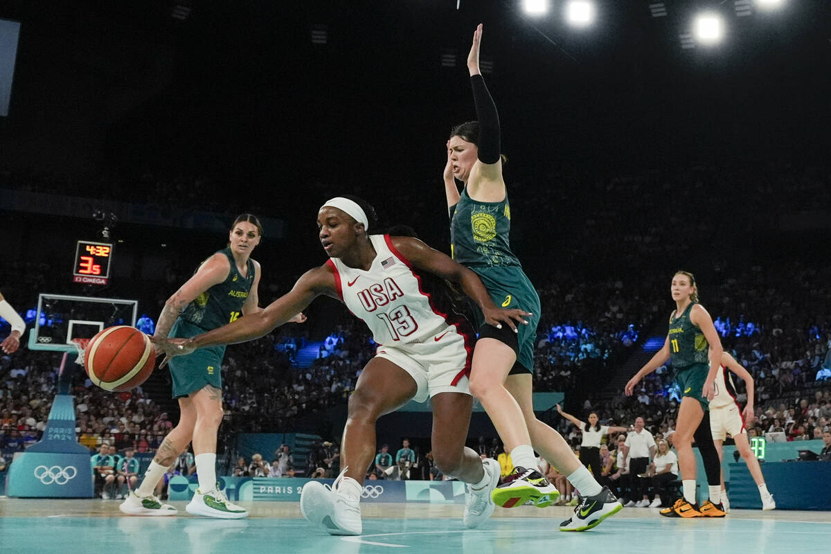 United States' Jackie Young (13) scrambles for ball as Jade Melbourne (2), of Australia, guards ...