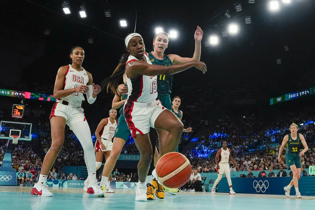 United States' Jackie Young (13) chases down the ball against Australia during a women's semifi ...