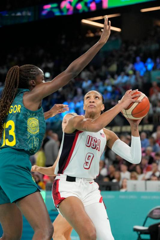 United States' A'ja Wilson (9) goes up against Ezi Magbegor (13), of Australia, during a women' ...