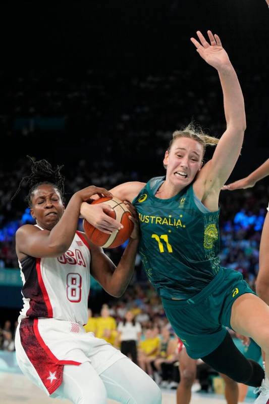 United States' Chelsea Gray (8) and Alanna Smith (11), of Australia, battle for possession duri ...