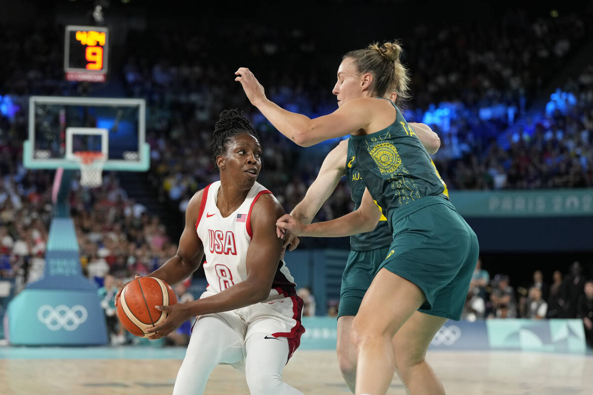 United States' Chelsea Gray (8) drives past Steph Talbot (6), of Australia, during a women's se ...