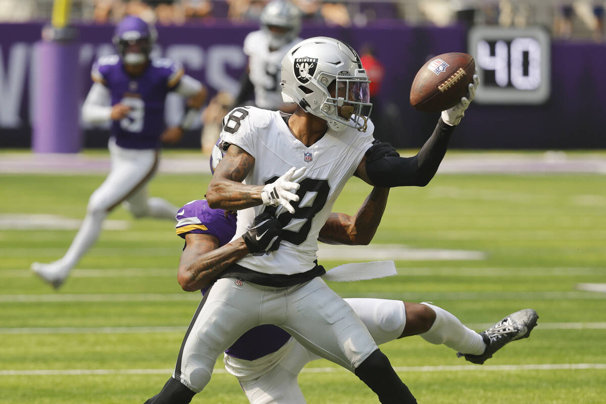 Las Vegas Raiders cornerback Jack Jones (18) intercepts a pass intended for Minnesota Vikings w ...