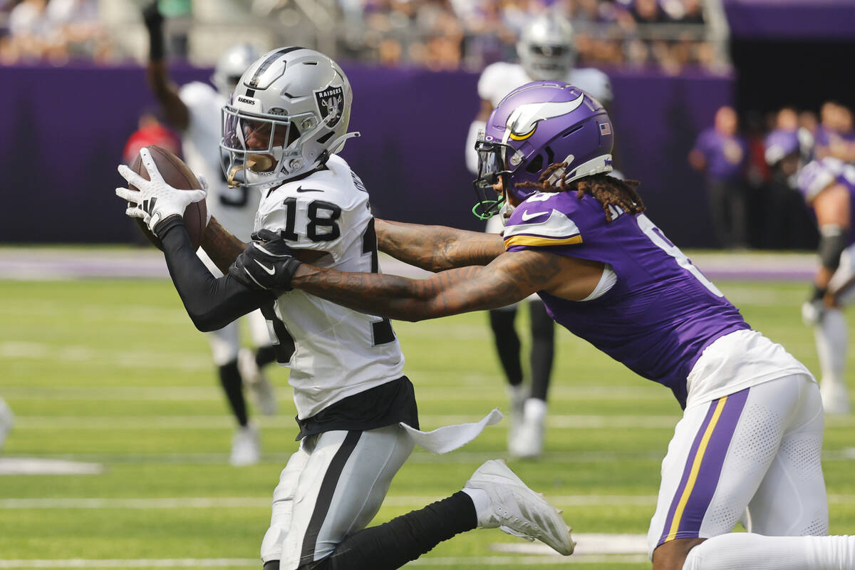 Las Vegas Raiders cornerback Jack Jones (18) intercepts a pass intended for Minnesota Vikings w ...